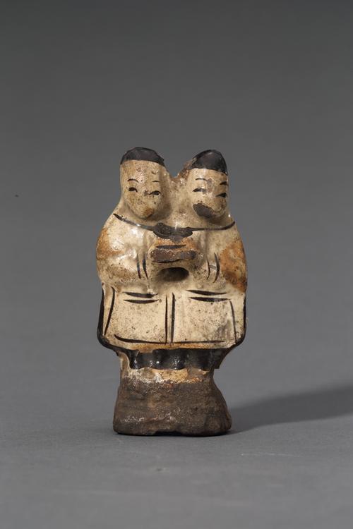 白釉瓷黑彩双连男立像