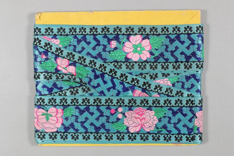 蓝色缎地牡丹万字云头纹绦