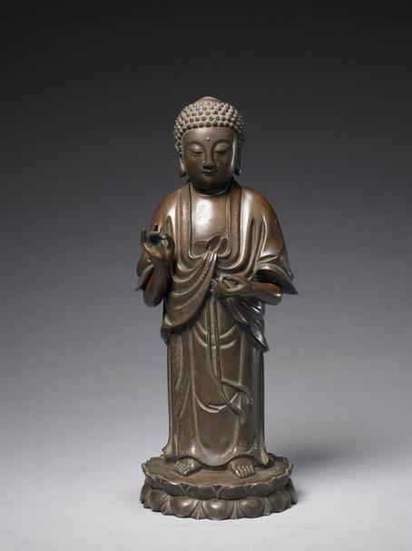 “石叟”款铜嵌银丝佛立像