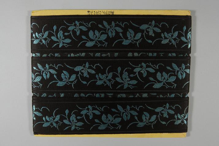 元青色缎地湖色净芝兰花纹绦