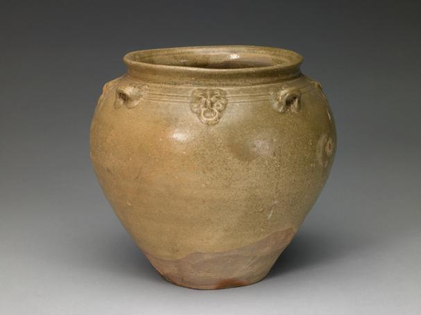 青釉塑贴铺首四系罐