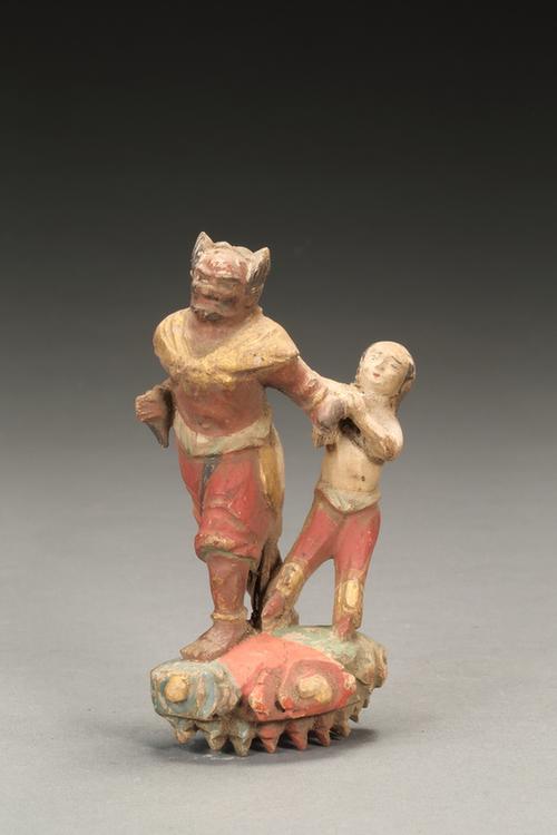 木雕彩绘怪人牵童立像