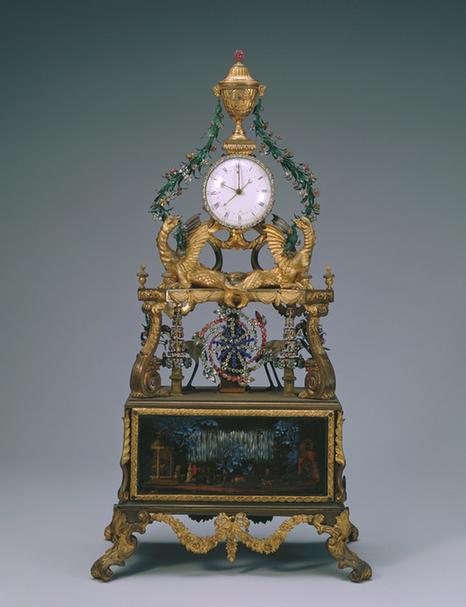 铜镀金嵌料石花转水法跑人上顶瓶式规矩钟