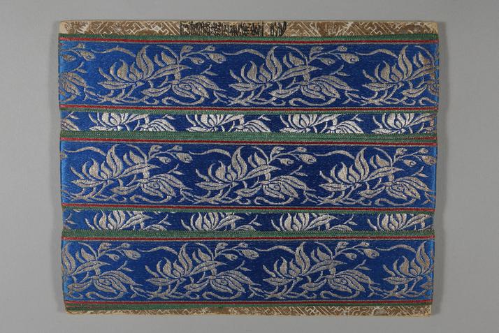 品蓝色缎地织银兰花纹绦