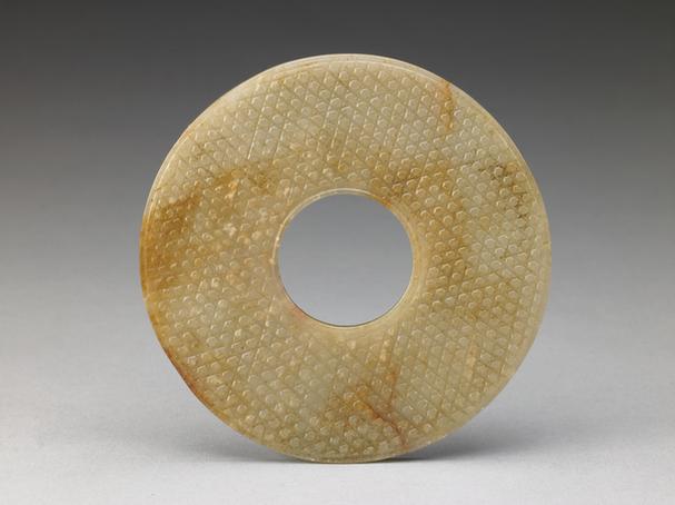 青玉兽面蒲纹璧