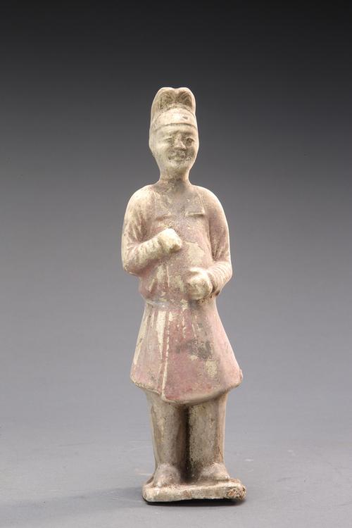 陶黄红釉男立俑