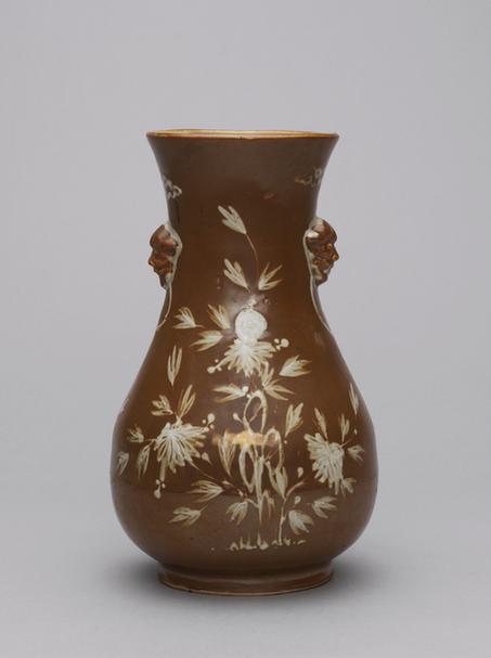 酱釉白花兽面耳瓶