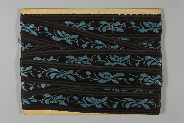 元青色缎地湖色净芝兰花纹绦