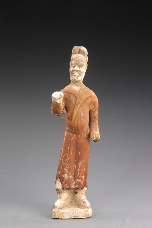 陶黄釉拉马男立俑