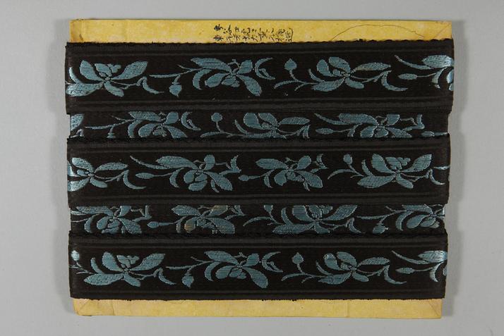 元青色缎地湖色净芝兰花纹绦