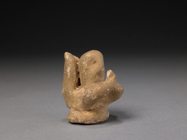 石湾窑黄釉卧人像