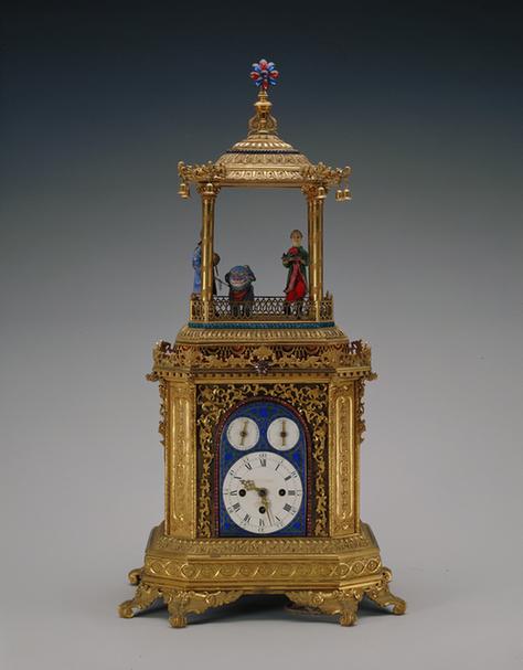 铜镀金亭式番人进宝乐钟