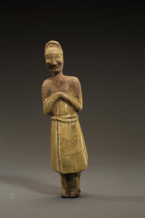 陶黄釉拱手男立俑