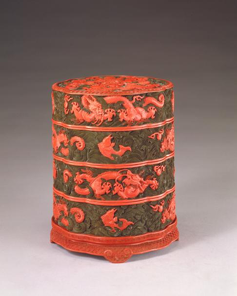 剔彩鱼龙变幻纹葵瓣式三层盒