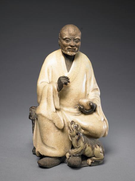 石湾窑黄釉伏狮罗汉坐像