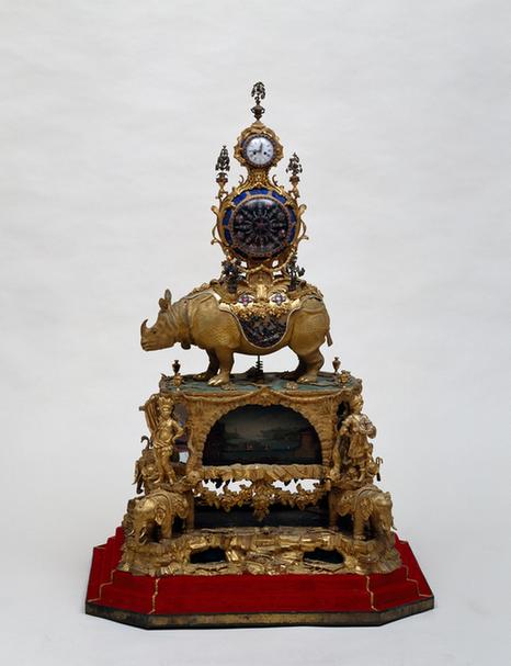 铜镀金转花跑人犀牛驮表