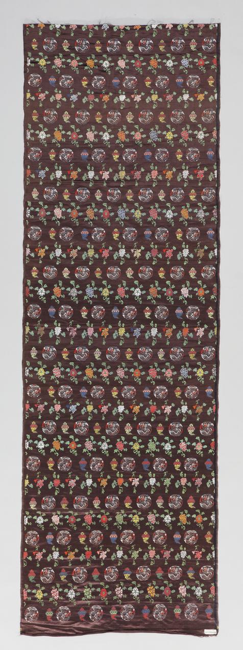 绛紫色五彩寸蟒缎