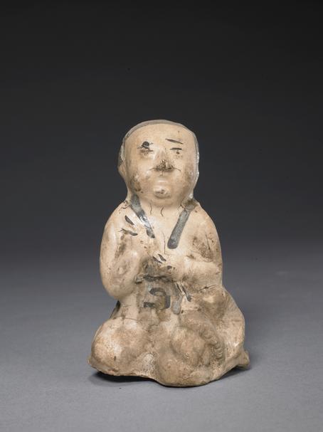 白釉瓷黑彩持物童子像