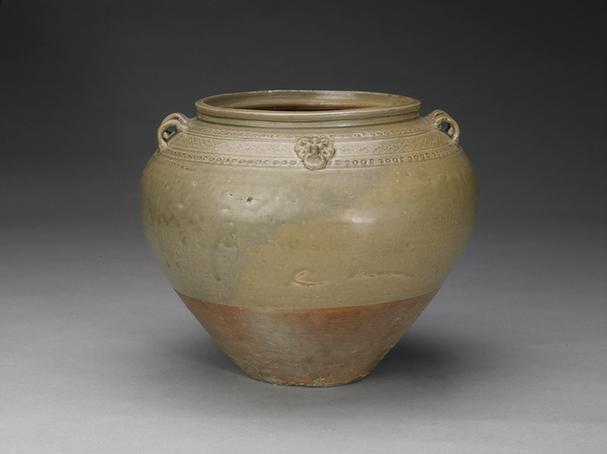 青釉铺首锦纹四系罐