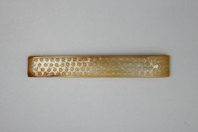 白玉虎面蚕纹璏