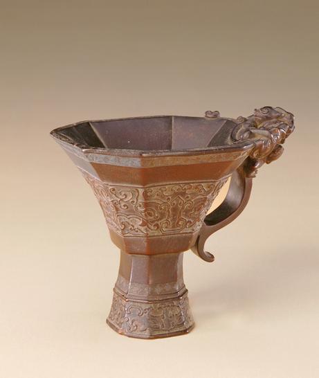 犀角雕兽面纹八角爵杯