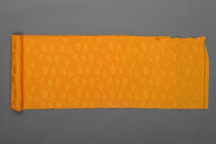 杏黄色八吉祥纹绉绸