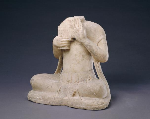 石吹排箫伎乐坐像