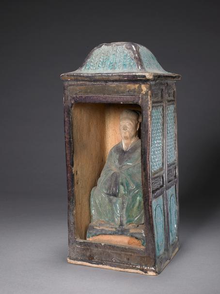 陶孔雀绿加紫釉坐轿俑