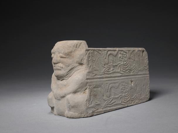 狩猎纹刻怪人头花砖