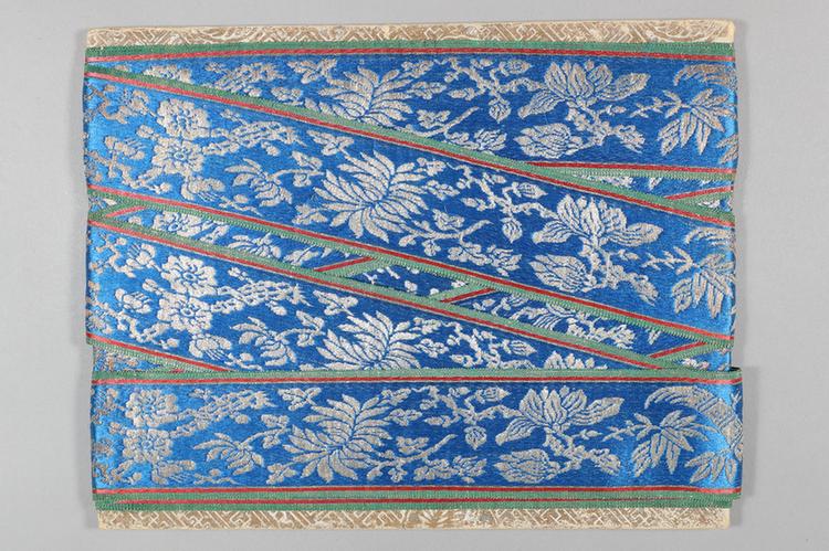 品蓝色缎地织银梅兰竹菊牡丹纹绦