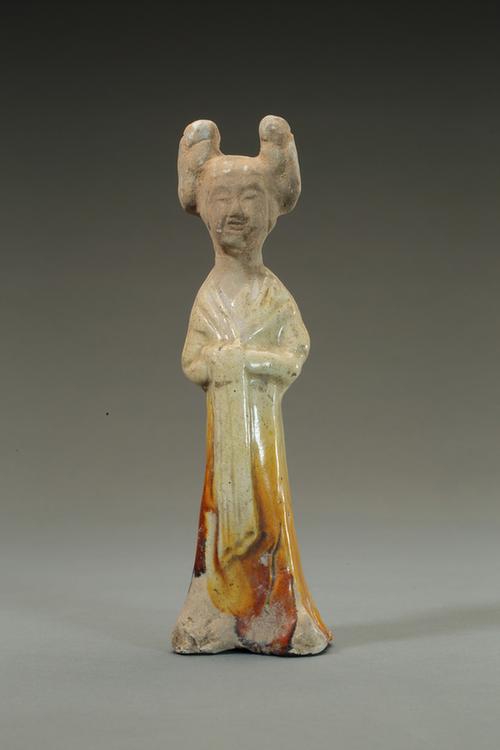 陶黄釉双髻女立俑