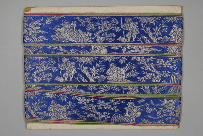 品蓝色缎地织银岁寒三友纹绦