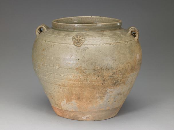 青釉塑贴铺首四系罐