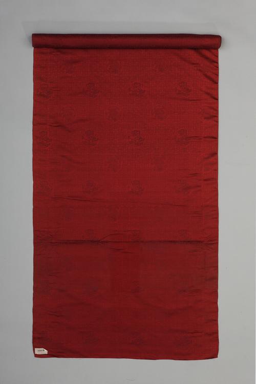 绛紫色四合如意小团龙纹暗花缎