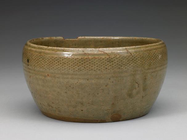 青釉印网格纹碗