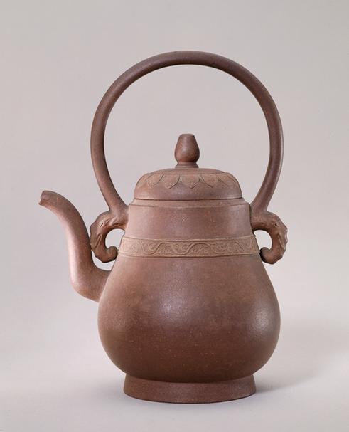 宜兴窑紫砂印卷枝纹提梁壶