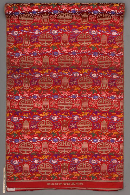红色地八宝长圆寿字纹织金锦