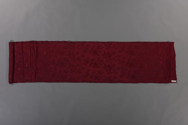 绛紫色竹梅海棠纹花绸